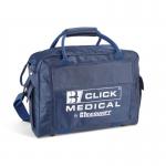 The photograph shows two empty first aid bags by Click Medical. One is a blue Touchline sports bag and the other is a standard empty first aid bag. Both bags have a sturdy design with multiple compartments and zippers for organization.