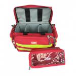 This photograph showcases a bright red Click Medical trauma bag measuring 44X5X28cm. The bag is empty, waiting to be filled with essential first aid supplies. The bag features the signature Click Medical logo and has multiple pockets for easy organization.