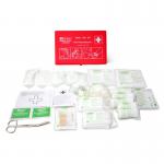 The image shows a compact gray travel box with the words Medical Travel First Aid Kits printed in bold white letters. Upon opening the box, it reveals a neatly organized layout of essential first aid supplies, including bandages, antiseptics, and gauze. The label on the box reads Click Medical German Vehicle First Aid Kit DIN 13164, indicating its high-quality and reliable contents.