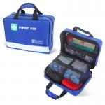 This image features a durable blue combination bag designed by Click Medical for site safety and first aid purposes. The bag has multiple compartments and comes equipped with a red cross symbol on the front.