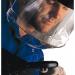 The photograph features a variety of Centurion hard hat accessories and parts, including the S91C chinguard in a clear color. The chinguard appears sturdy and durable, with subtle design details and a secure attachment.