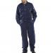 The photograph shows a Beeswift Premium Boilersuit in navy blue, size 44. The Boilersuit has multiple pockets, a zip-up front, and is made of sturdy fabric. The color is rich and the fit is comfortable, making it ideal for various industrial and mechanical work environments. The Boilersuit is adorned with the Beeswift logo, showcasing its high-quality and reputable brand.