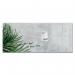 This photograph captures a stunning Artverum Glass Board in the Botanic Design, measuring 1300x550x18mm and mounted on the wall. The smooth, sleek surface reflects light, revealing intricate leaf patterns that add a touch of nature to any space.