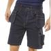 Two pairs of navy blue cargo shorts with multiple pockets sit side by side, showcasing the durable and functional design of these Beeswift Grantham multi-purpose shorts. The beeswax logo is prominently displayed on the front pocket of each pair.