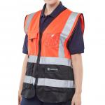 In the picture, you can see Beeswift High Visibility Vests in a striking red and black color combination. Made from durable materials, the vests feature a sleek executive design with a waistcoat style. The bright reflective strips ensure maximum visibility for safety in high-risk environments.