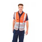 In the photo, you can see the vibrant red and grey hues of the Beeswift High Visibility Vests. The executive waistcoat design adds a touch of professionalism. The large, reflective strips ensure maximum visibility for wearers in any setting.