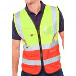 This photograph showcases Beeswift branded high visibility vests in a vibrant Saturnyellow and Red two-tone design. The vest is size 5XL and features an executive waistcoat style. It is perfect for keeping workers visible and safe in low light conditions.