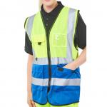 In the picture, there are two high visibility vests from Beeswift. One is in Saturn Yellow and the other is in Royal Blue. They are both labeled as Executive Waistcoats and are size 3XL. The bright colors of the vests can be seen vividly, making them ideal for ensuring visibility and safety in any work environment.