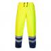 This photo shows a pair of premium waterproof trousers from the brand Hydrowear. They are in the color Saturn Yellow and Navy, with the brands logo visible on the leg. The trousers are designed to be high visibility and are perfect for outdoor work in wet conditions.