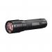This photograph features a sleek, compact Ledlenser P7 Core LED torch from the trusted brand Ledlenser. The torch emits a bright white light, perfect for any of your outdoor adventures. The device is designed with a sturdy, ergonomic handle for easy grip and control.