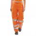 A photo of Beeswift high visibility trousers for ladies in orange shows lightweight, durable fabric with reflective strips for increased visibility. The trousers have a comfortable fit and are ideal for various work environments.