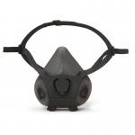 In the photo, two black Moldex half masks are visible, one in a small size. They are made of silicone and have a curved shape. The masks feature a double strap and have a sleek, modern design.