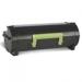 The photograph features a pack of Lexmark ink cartridges in their original packaging. The cartridges are black in color and each has a label that reads Lexmark OEM. The pack includes one cartridge with the code 60F2X0E and has a page yield of 20,000 pages.
