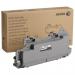 In the photo, there are several OEM Xerox waste toner containers labeled 115R00128. They have a capacity of 30000 pages and are the original waste toner product from Xerox. The containers are full and ready to be replaced.