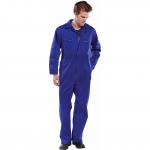 The photograph displays a bright royal blue Beeswift Heavy Weight Boilersuit in size 36. The heavy fabric and full body coverage suggest durability and protection. Multiple pockets and adjustable cuffs are visible. The Beeswift logo can be seen on the chest.
