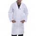 The image shows a white poly-cotton warehouse coat from Beeswift, with the brand name prominently displayed on the breast pocket. The coat has long sleeves, a button-up front, and a collar. It appears to be in size 36 and is hanging on a hanger in a warehouse setting. The coat is clean and has a professional look.