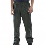 The photograph features a pair of olive green Beeswift Super B-Dri trousers, size medium. The high-quality fabric and construction can be seen, with the Beeswift logo displayed proudly. These trousers are designed for durability and protection in wet conditions.