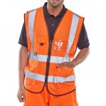 In the photo, there are multiple bright orange high visibility vests on a white background. The vests are of various sizes, with the front showing the Beeswift logo and reflective strips. The executive waistcoat style features a collar and zipper, adding a professional touch. Perfect for safety and visibility in a work environment.