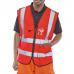 The image shows vibrant red high visibility vests from Beeswift, specifically their Executive Hi Viz Waistcoat in size XL. The vests have a sleek, professional design and are made with durable materials. They feature reflective stripes for added visibility and safety.