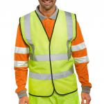 The image shows two yellow high visibility vests by Beeswift, size large, with the B-Seen and EN ISO 20471 labels on the front. The vests are made for safety with reflective stripes and durable materials.