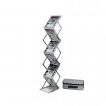 The photograph shows two silver Deflecto floor standing display units, each equipped with a double-sided folding stand and designed for A4-sized materials. The sleek and modern design is perfect for showcasing important information or advertising products.