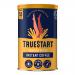 Image shows six 100g jars of TrueStart Barista Grade Instant Coffee arranged in two neat rows. Clear glass jars with black screw lids reveal dark brown granules. White labels display the TrueStart logo and product name with subtle brown coffee graphics.