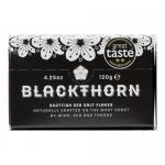 Image shows a rectangular carton holding twelve identical 120 g Blackthorn Salt containers arranged in two neat rows. Each container displays a clear Blackthorn Salt logo and simple labeling. The open box reveals uniform packing and visible tops of the grocery units. Soft lighting and faint shadows.