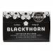 Image shows a rectangular carton holding twelve identical 120 g Blackthorn Salt containers arranged in two neat rows. Each container displays a clear Blackthorn Salt logo and simple labeling. The open box reveals uniform packing and visible tops of the grocery units. Soft lighting and faint shadows.