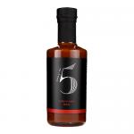 A glossy 200ml glass bottle stands upright, filled with deep reddish-brown sauce. A black-and-red label displays Chilli No. 5 and Louisiana BBQ Hot Hickory Smokey. A metal cap seals the neck. Six identical bottles form a neat cluster, light highlighting the thick, glossy texture.