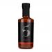 A glossy 200ml glass bottle stands upright, filled with deep reddish-brown sauce. A black-and-red label displays Chilli No. 5 and Louisiana BBQ Hot Hickory Smokey. A metal cap seals the neck. Six identical bottles form a neat cluster, light highlighting the thick, glossy texture.