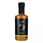 A cluster of six 200ml glass bottles stands in a neat pack, each filled with bright wasabi-green chilli sauce. Sleek black caps and matching bold green labels feature 'Chilli No. 5' branding, chilli and wasabi graphics, and small ingredient text. Studio-lit, shallow depth.