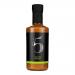 A cluster of six 200ml glass bottles stands in a neat pack, each filled with bright wasabi-green chilli sauce. Sleek black caps and matching bold green labels feature 'Chilli No. 5' branding, chilli and wasabi graphics, and small ingredient text. Studio-lit, shallow depth.