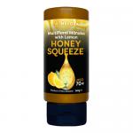 Eight glass jars of Melora Manuka Honey Lemon Squeeze (330g) sit in neat rows. Bright lemon-yellow labels with lemon graphics and honeycomb accents wrap clear glass, showing golden honey beneath silver lids on a white background.