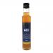 A clear 250ml glass bottle of The Scottish Bee Company apple cider vinegar stands upright, amber liquid with a pale pink tint. Its white label features strawberry and peppercorn illustrations, the brand logo and product text, topped with a silver screw-cap.