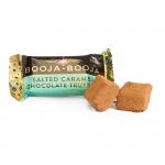 The image shows a compact box of Booja-Booja salted caramel truffles: two glossy dark chocolate spheres sit in a molded tray, each sprinkled with coarse sea-salt flakes. The simple brown packaging bears a subtle logo and minimal labeling.