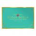 A neat box of sixteen round chocolate truffles sits open, each glossy, dark-brown ganache dusted with cocoa. Several truffles show salted caramel swirls or a sprinkle of sea salt. Simple branded packaging and a clean backdrop frame the confections.