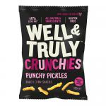 Photo shows a 100g Well & Truly Crunchies Punchy Pickle bag beside a neat pile of fourteen smaller Well & Truly crisps packets. Vibrant green and yellow wrappers display pickle graphics and bold white branding. Several open packs reveal ridged, golden chips on a pale surface.