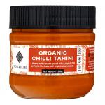 A clear PET bottle of Med Cuisine Organic Chilli Tahini shows a smooth, creamy beige paste streaked with red chili flecks. Twelve identical 200g bottles sit in neat rows; each front-facing label displays the Med Cuisine name and product title against a simple, clean design. With a visible screw cap.