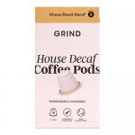 A rectangular kraft-style box features the bold GRIND logo across the front, with decaf and 90g labels, compostable icons and simple illustrations of coffee pods. Earthy brown and muted green colors, clean typography and a stacked row of ten pods appear on the artwork Soft matte texture and shadows