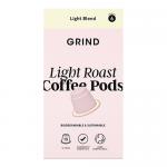 A compact rectangular box of Grind Coffee Roasters pods sits on a neutral surface. Natural kraft packaging displays the Grind logo, 'Home Compostable' and 'Light' text, weight and quantity markings, a stylized coffee bean graphic, and small compost/recycling icons in muted tones. With a soft shadow.