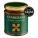 Six identical 200ml Gymkhana Classic Tandoori Marinade bottles stand in a neat row. Transparent containers show a deep red-orange marinade. Each bottle bears a front label with the Gymkhana logo, the product name and small ingredient and nutrition text. Soft shadows fall, and background stays plain.