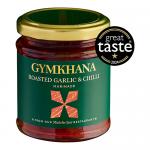 Six clear glass jars sit side by side, revealing a glossy deep-red roasted garlic and chilli marinade flecked with chilli seeds and garlic bits. Each jar has a bold Gymkhana label with decorative motifs and a black lid, set against a simple neutral background.