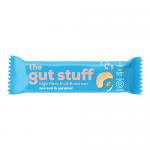 Image shows several wrapped bars beside one unwrapped Sea Salt & Caramel high fibre fruit and nut bar. The unwrapped bar reveals a glossy caramel layer, scattered sea-salt flakes, chopped nuts and dried fruit, and a dense, fibrous texture with slightly uneven edges. Wrapper shows simple, brand logo.