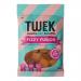 Bright, glossy packet labeled Tweek Sweets Fizzy Fusion sits on a plain surface. A clear window reveals 14 sugar-dusted, irregular chewy pieces in neon pink, green, yellow and orange. Tiny fizz crystals glisten on each tongue-shaped sweet, with colorful branding and playful typography on the wrapper.