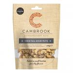 A clear resealable pouch reveals a colorful mix of dried fruit, roasted nuts and mixed seeds. The front label shows the Cambrook name in bold with bright orange and green accents and a transparent window that displays the varied textures and natural hues.