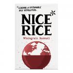 A rectangular bag of Nice Rice wholegrain basmati sits upright on a plain surface. Warm earth-toned packaging shows a clear window revealing long brown grains. A bold logo sits near the top, product text and small icons line the sides, and a soft pastoral illustration wraps the base with soft sheen.