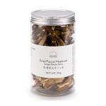 Photo shows a stack of twelve Emma Basic 45g packets of dried porcini mushrooms. Brown kraft-style pouches display a clear window revealing dark, wrinkled mushroom pieces. Simple white labels with brand name and product illustration sit atop a neutral background. Matte finish and faint condensation.