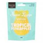 A bright resealable yellow-green pouch displays the Sweet Lounge logo and bold Vegan Fizzy Tropical Pineapple text. Illustrated pineapples and tropical leaves surround a clear window revealing small pineapple-shaped yellow gummies dusted with white fizzy sugar crystals. Shiny laminate and bold hues.
