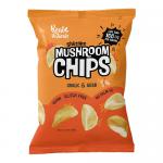A colorful pack of Real Naturals Shiitake Mushroom Chips Garlic & Herb sits against a plain background. The bag shows illustrated shiitake mushrooms, garlic cloves and sprigs of herbs. Crispy brown mushroom chips tumble out, showing ridged, textured surfaces.