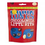 Glossy pouch displays the Tony's Chocolonely logo bold across the front. Colorful packaging frames a window showing tiny triple-chocolate pieces in dark, milk and white tones. Playful illustrations and uneven stripes create a lively, handcrafted confectionery look. Small foil crinkles add tactile detail.